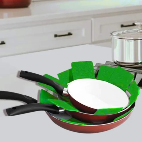 Pot and pan protector pads being used in between pans